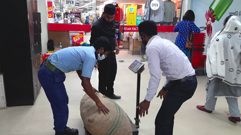 The grocery store purchasing produce from the farmers