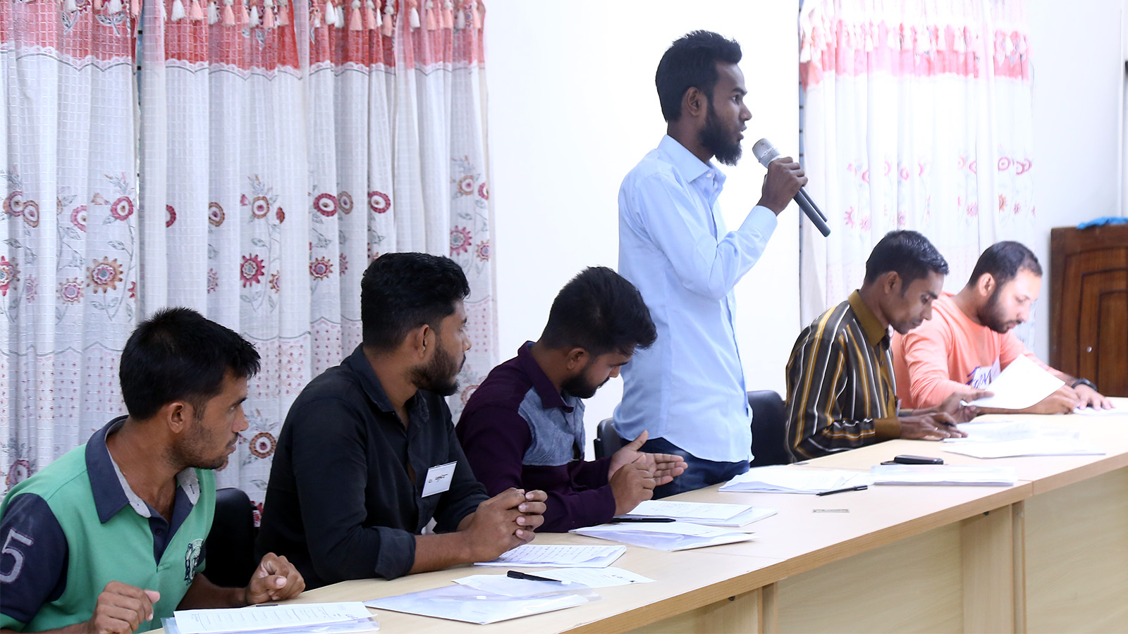 A participant pitching his business plan to the judges panel