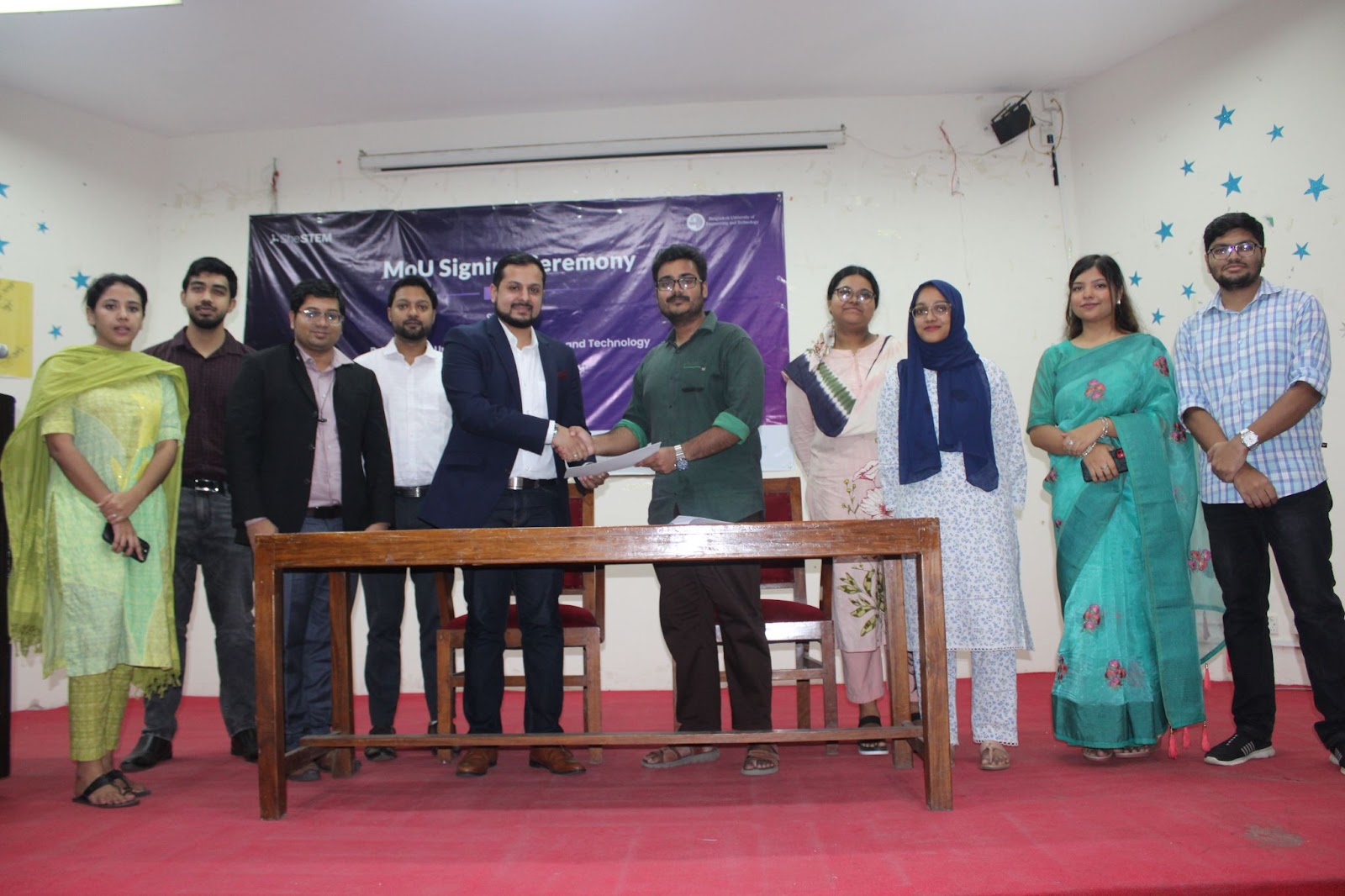 Omar Farhan Khan, Senior Business Consultant and Project Manager at LightCastle Partners signing the agreement alongside Faiyaz Ahsan,  President of BUET Career Club.